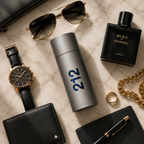 Flat lay composition featuring 212 Men perfume with luxury accessories including sunglasses, watch, jewelry, and leather goods on a premium marble background.