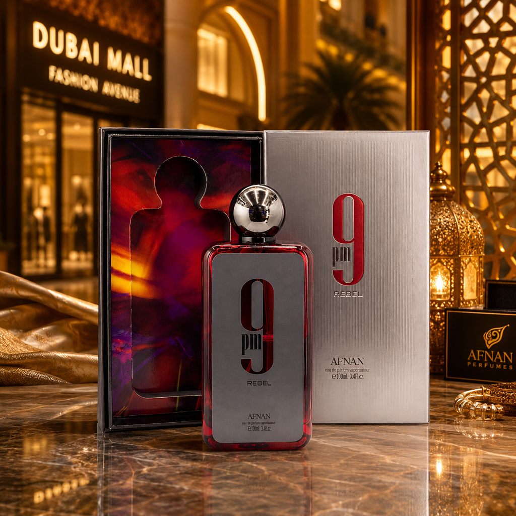 Afnan 9PM Rebel perfume displayed in a luxury Dubai-inspired boutique setting with elegant golden lighting.