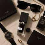 Black Afgano Eau de Parfum arranged with luxury sunglasses, watch, jewelry, and leather accessories on marble background.