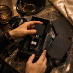 Black Afgano luxury perfume being removed from premium gift box with tissue paper and ribbon for a luxury unboxing experience.