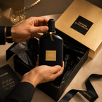 Luxury unboxing experience showcasing Black Orchid Eau De Parfum with premium gift box, tissue paper, ribbon, and elegant packaging presentation.