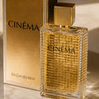 Close-up macro shot of Cinema perfume bottle with premium gold detailing