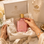 Creed Eladaria perfume presented in luxury gift packaging with premium tissue paper ribbon and elegant unboxing experience