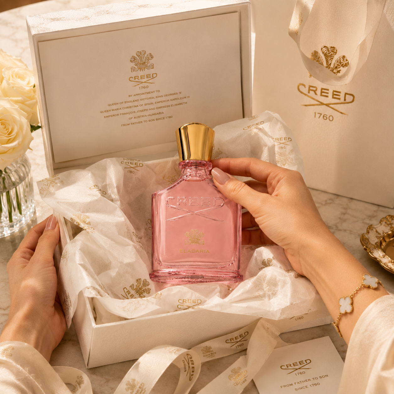 Creed Eladaria perfume presented in luxury gift packaging with premium tissue paper ribbon and elegant unboxing experience