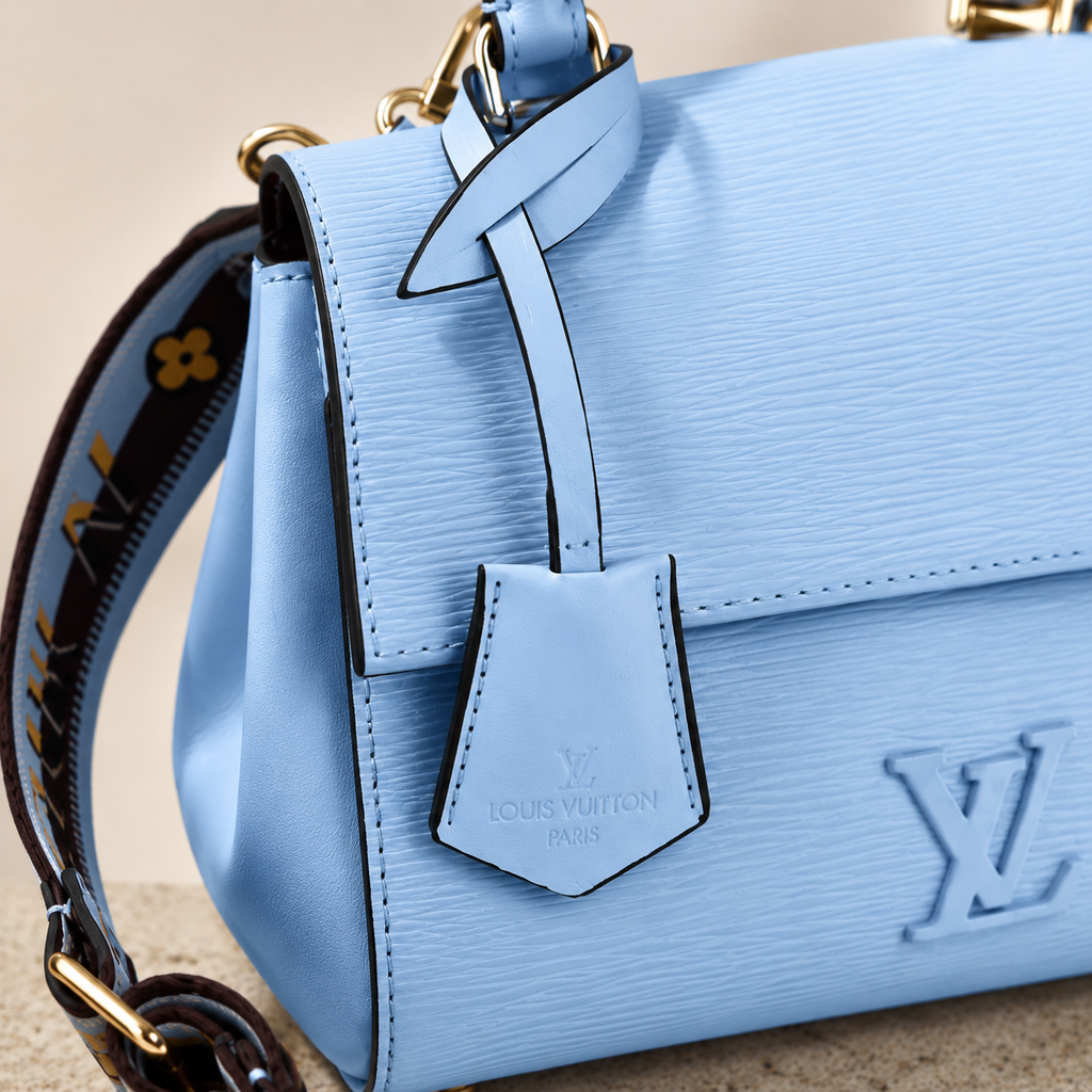 Sophisticated pastel blue structured handbag designed for luxury fashion styling and daily elegance.