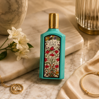 Flora Gorgeous Jasmine floral perfume styled on marble surface with luxury accessories