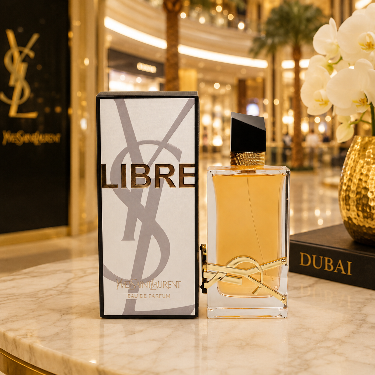Luxury Libre perfume displayed in elegant Dubai-inspired luxury boutique environment with warm golden lighting