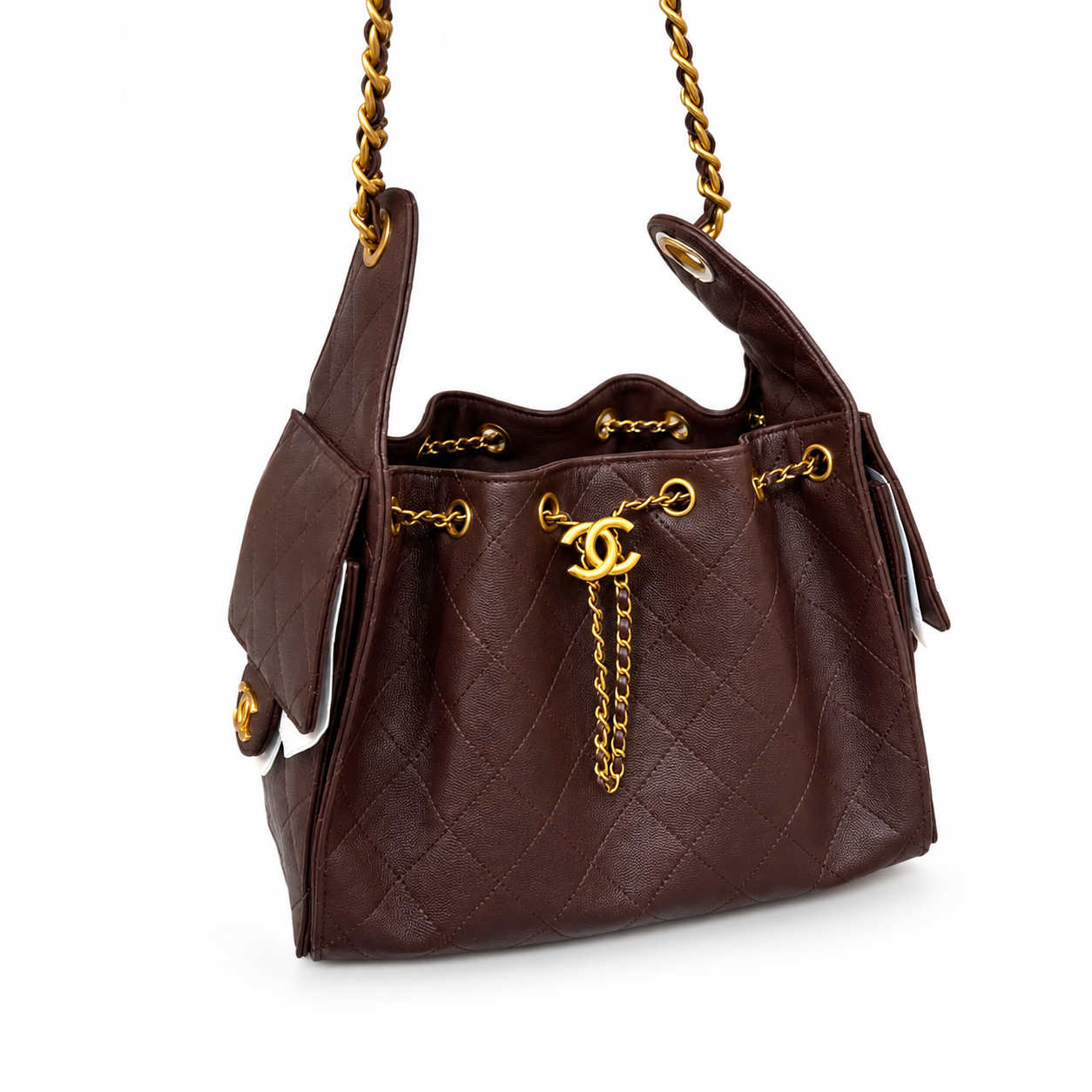 A dark brown quilted leather handbag with gold-tone hardware, featuring a drawstring top, a front flap pocket with a gold CC turn-lock, and a gold chain strap, shown on a white background.