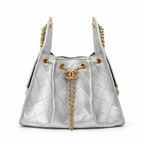A silver quilted leather handbag with gold-tone hardware, featuring a prominent interlocking CC logo on a chain detail at the front, set against a plain white background.