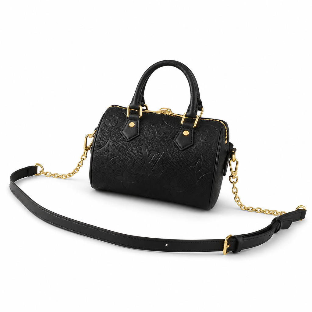 Luxury black embossed leather handbag with gold hardware and detachable strap on white background