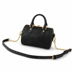 Luxury black embossed leather handbag with gold hardware and detachable strap on white background