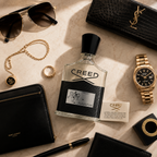 Premium flatlay composition featuring Creed Aventus perfume with sunglasses, watch, jewelry, and leather accessories.
