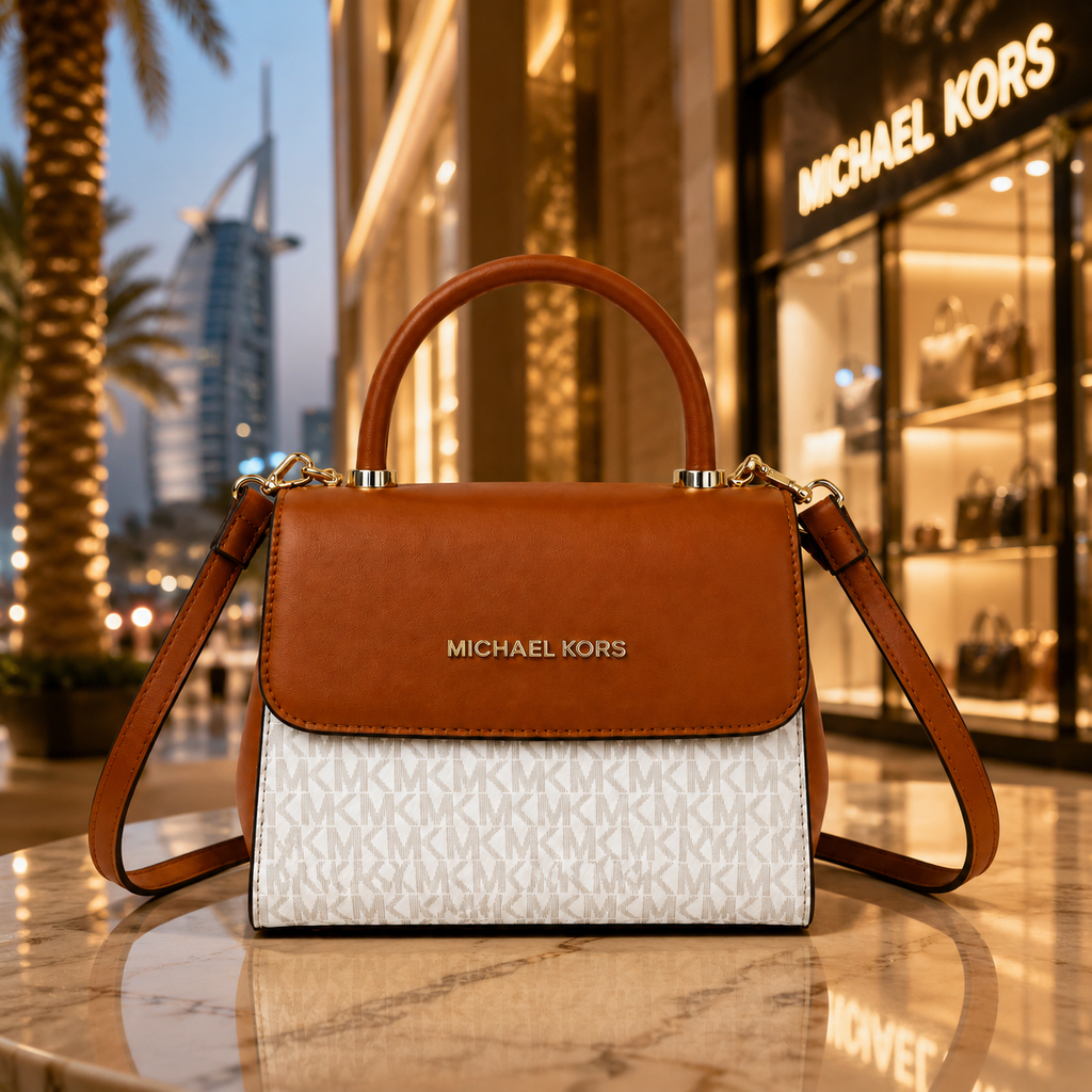 Elegant luxury women’s handbag displayed in a premium Dubai-inspired boutique setting with warm lighting and sophisticated fashion atmosphere.