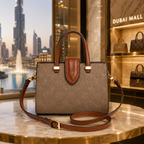 Elegant women’s luxury tote handbag displayed in premium Dubai-inspired boutique environment with warm lighting