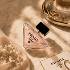 Premium floral perfume displayed on marble surface with luxury accessories in an elegant editorial-style composition.