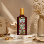 Luxury floral Eau de Parfum displayed on marble surface with elegant accessories and premium editorial styling.