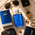 Blue men's perfume bottle arranged with luxury watch, sunglasses, jewelry, and leather accessories in a premium flatlay composition.