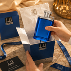 Luxury men's blue fragrance presented in premium gift packaging with tissue paper, ribbon, and elegant unboxing presentation.