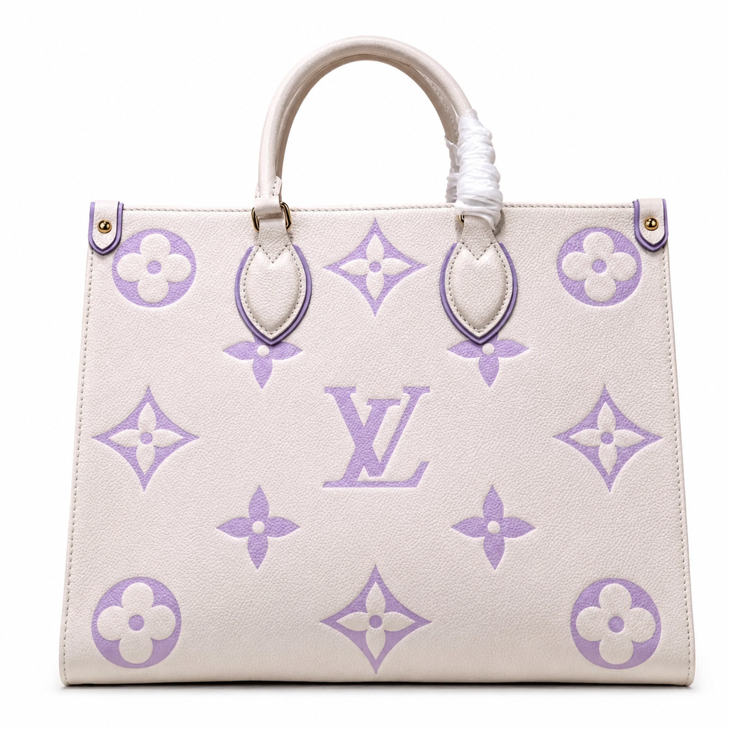 Designer handbag with purple monogram pattern on a white background