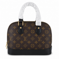Luxury monogram dome handbag with black leather trim and gold hardware on a white background for women's fashion.