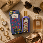 Floral perfume flat lay with sunglasses watch jewelry and luxury fashion accessories
