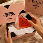 Luxury perfume unboxing experience with elegant packaging, tissue paper, ribbon details, and premium gift presentation.