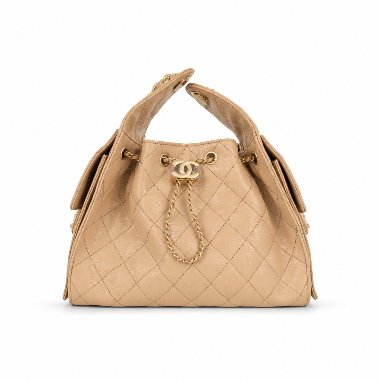 A beige quilted leather handbag with gold-tone hardware, featuring a top handle, drawstring closure, and a signature interlocking CC clasp on a white background.