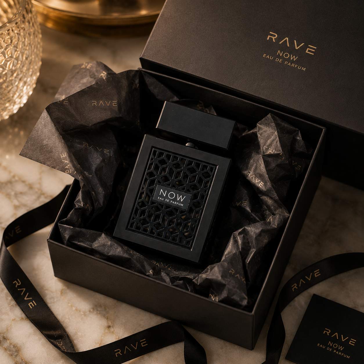 NOW Eau de Parfum for men displayed with luxury fashion accessories in premium editorial flatlay composition.