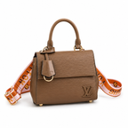 Premium brown textured leather handbag with gold hardware and adjustable luxury shoulder strap on white background.