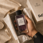 Luxury fragrance bottle presented inside elegant gift packaging with premium tissue paper and ribbon for a sophisticated unboxing experience.