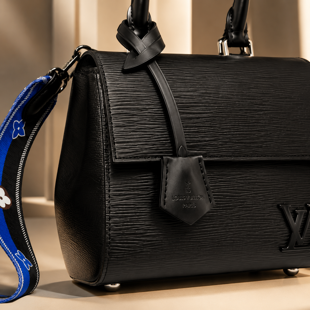 Elegant black luxury handbag displayed in premium Dubai-inspired boutique environment with warm golden lighting