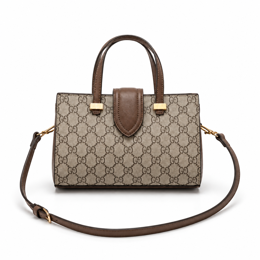 Luxury women’s monogram tote handbag with brown leather handles and adjustable shoulder strap on white background