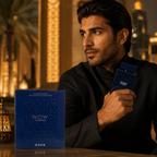 Elegant male model holding NOW Intense Eau De Parfum in a luxury UAE-inspired lifestyle setting