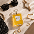 Premium women's perfume styled with sunglasses, jewelry, watch, and luxury accessories in a flat lay composition.