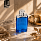 Luxury men's fragrance bottle displayed on marble surface with premium accessories and sophisticated editorial styling.