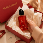 Luxury women's perfume presented in elegant gift box with premium tissue paper and luxury unboxing experience.