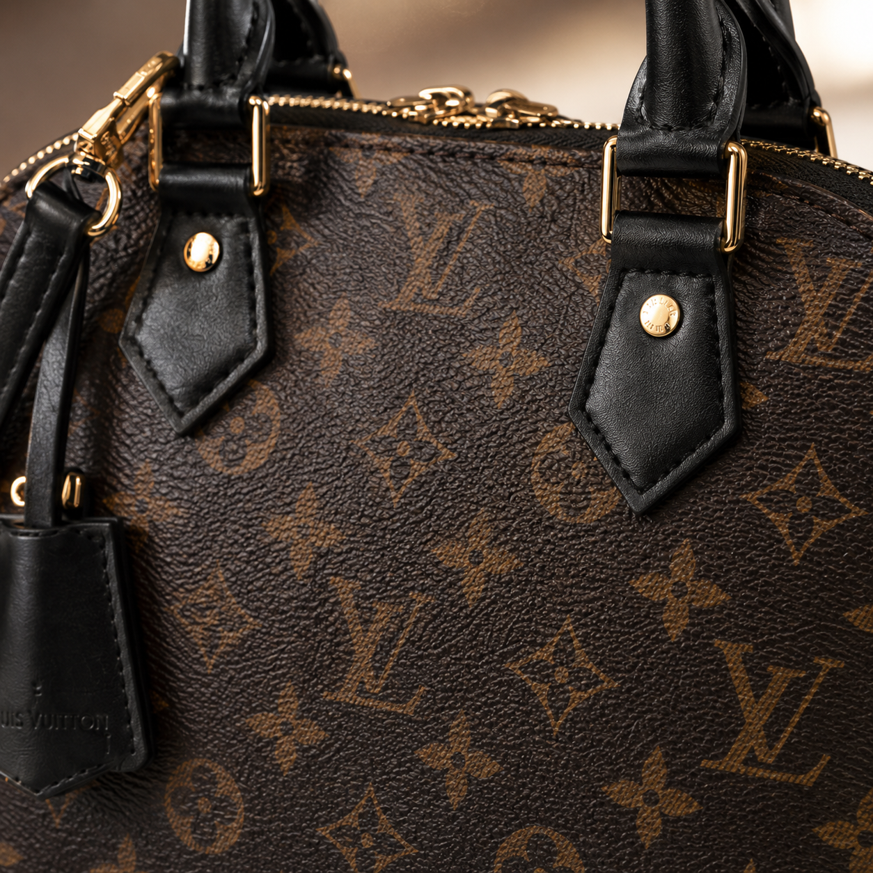 Luxury brown monogram women handbag with gold hardware and structured silhouette