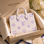 Louis Vuitton handbag with purple monogram pattern in a branded box.